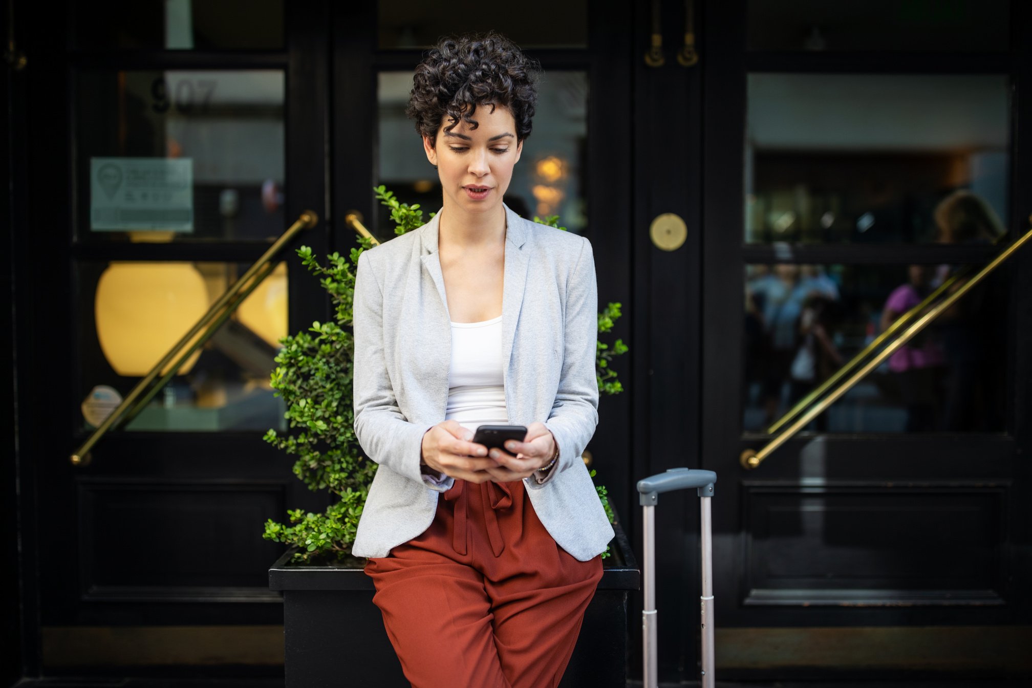 Businesswoman booking online taxi