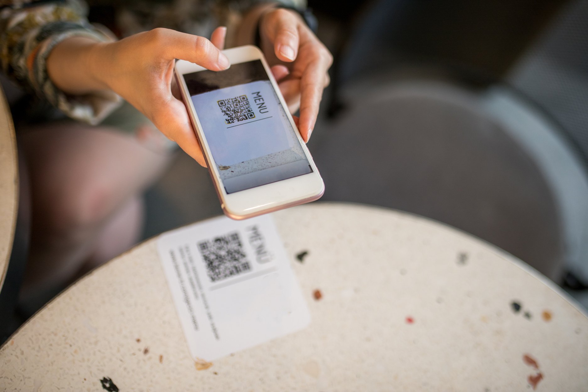 woman scanning qr code for online menu